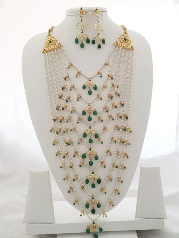 Satlada necklace with pearls, green stones, and gold-polished jadau work by Kisa Hyderabadi Zevar