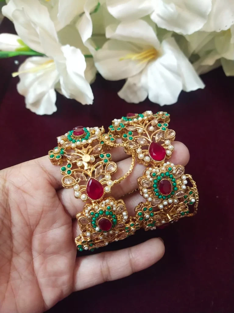 Colorful Jadau Bangles with red and green stones and gold polish by Kisa Hyderabadi Zevar