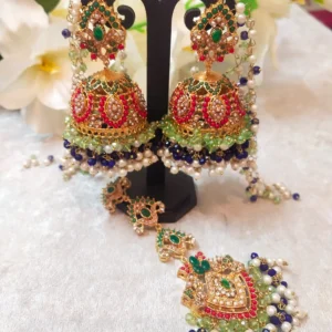 Blue Jhumka with Maang Tikka Set featuring Hyderabadi jadau craftsmanship and semi-precious blue and white stones.