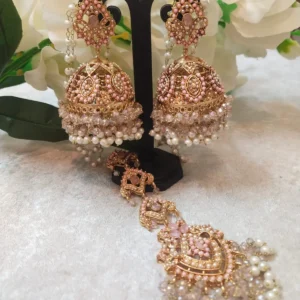 Pink Jhumka with Maang Tikka Set featuring Hyderabadi jadau work and semi-precious pink and white stones.