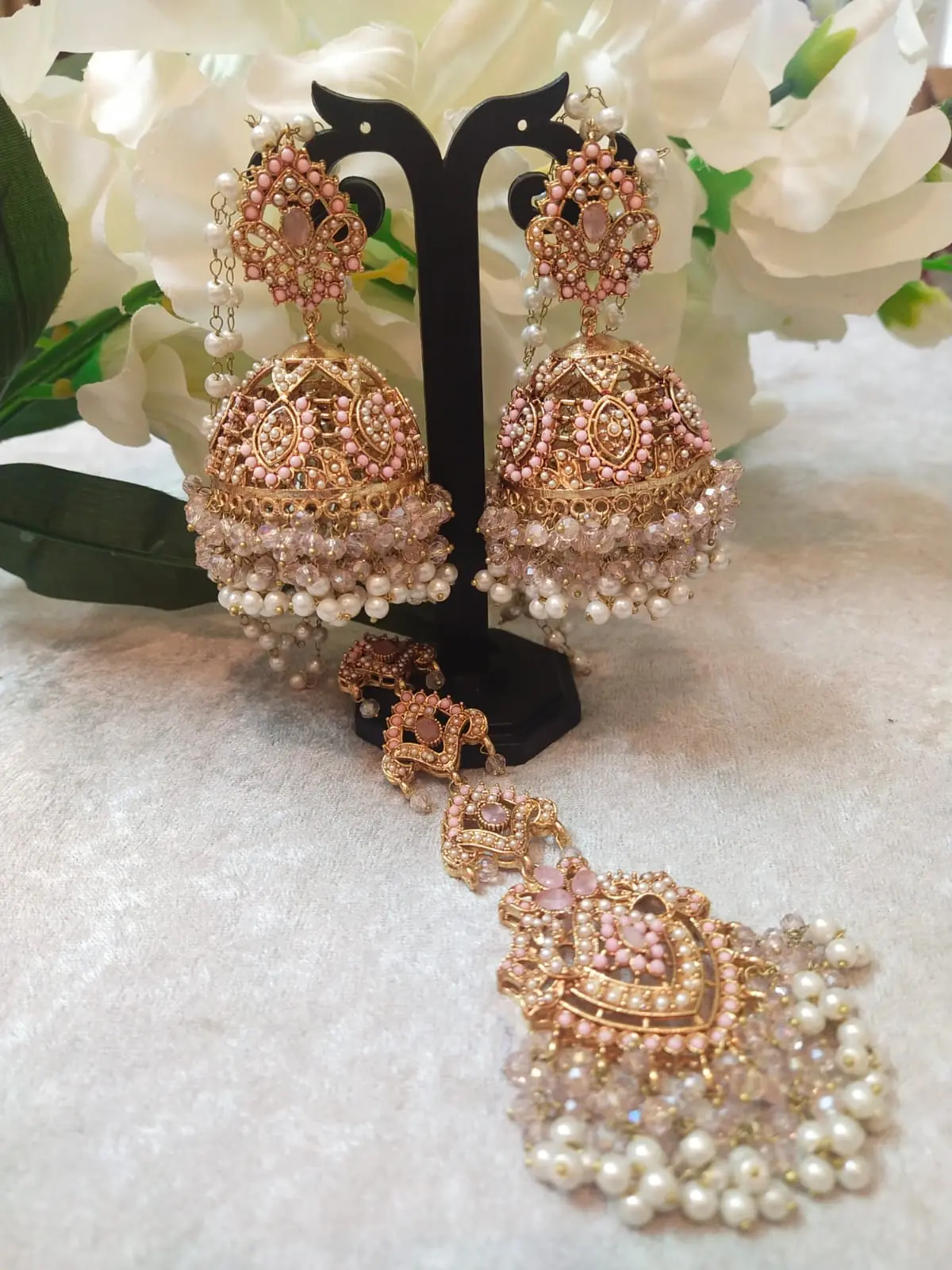 Pink Jhumka with Maang Tikka Set featuring Hyderabadi jadau work and semi-precious pink and white stones.