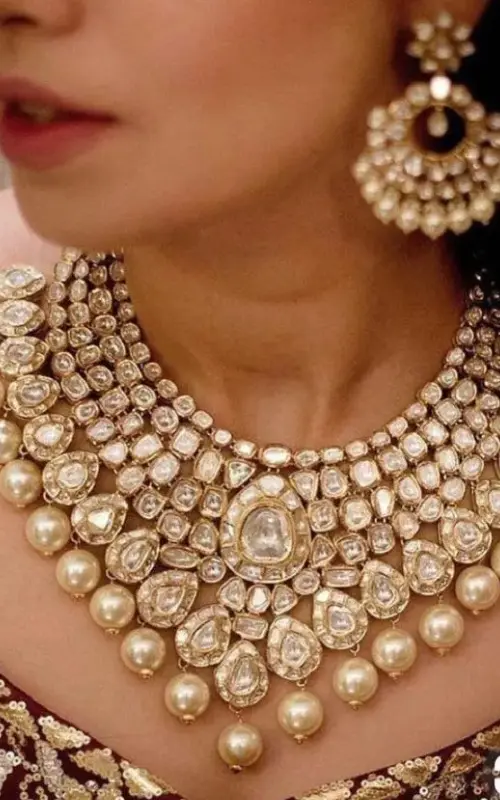 a model wearing beautiful jadau kundan jewellery