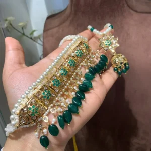 Erum Jadavi Lacha set with green stones, pearl strands and gold-plated panel
