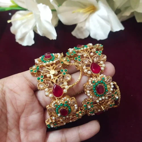 Colorful Jadau Bangles with red and green stones and gold polish by Kisa Hyderabadi Zevar